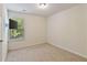 Simple bedroom with carpet flooring and a window at 5531 Radford Loop, Fairburn, GA 30213