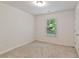 Bright bedroom with neutral walls and carpet at 5531 Radford Loop, Fairburn, GA 30213