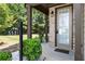Front entrance of townhome with brick facade and landscaping at 5531 Radford Loop, Fairburn, GA 30213