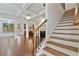 View of staircase leading to the upper level from the foyer at 5531 Radford Loop, Fairburn, GA 30213