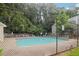 Inviting community pool with surrounding lounge chairs at 812 Wuthering Way, Norcross, GA 30093