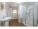 Clean basement bathroom with a walk-in shower at 308 Mainsail Ln, Woodstock, GA 30189