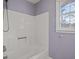 Bathroom with shower/tub combo and lavender walls at 308 Mainsail Ln, Woodstock, GA 30189