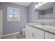 Bathroom with granite countertop and white cabinets at 308 Mainsail Ln, Woodstock, GA 30189