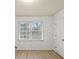 Well-lit bedroom with dual windows and closet at 308 Mainsail Ln, Woodstock, GA 30189