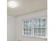Simple bedroom with window and wood-look floors at 308 Mainsail Ln, Woodstock, GA 30189