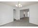 Simple dining room with white wainscoting and chandelier at 308 Mainsail Ln, Woodstock, GA 30189