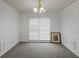 Bright dining room with neutral carpeting and wainscoting at 308 Mainsail Ln, Woodstock, GA 30189