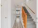 Hallway with hardwood floors, staircase and view to kitchen at 308 Mainsail Ln, Woodstock, GA 30189