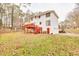 Two-story house with a deck and large backyard at 308 Mainsail Ln, Woodstock, GA 30189