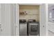 Laundry closet with washer and dryer at 308 Mainsail Ln, Woodstock, GA 30189