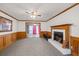 Spacious living room featuring a fireplace and wood paneling at 308 Mainsail Ln, Woodstock, GA 30189