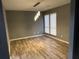 Dining area with gray walls, wood-look floors, and modern pendant lighting at 5391 Kelleys Mill Cir, Stone Mountain, GA 30088