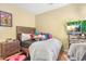 Cozy bedroom with a gray bedspread and workspace at 9569 Lakeview Cir, Union City, GA 30291