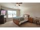 Bright bedroom with carpeted floor, large window, and built-in shelving at 200 Claret Way, Mcdonough, GA 30252