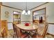 Charming dining room with wood table and floral wallpaper at 2572 Plum St, Snellville, GA 30078