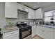 Bright kitchen with stainless steel appliances and granite countertops at 914 Oregano Se Ct, Conyers, GA 30094