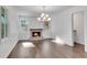 Sunlit dining room featuring hardwood floors and a fireplace at 1760 Corley Dr, Mableton, GA 30126