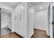 White hallway with hardwood floors and built-in storage at 1760 Corley Dr, Smyrna, GA 30126