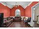 Dining room with hardwood floors and coral walls at 2001 Commonwealth Way, Grayson, GA 30017