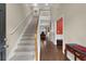 Two-story entryway with hardwood floors and staircase at 2001 Commonwealth Way, Grayson, GA 30017