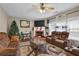 Living room with fireplace, hardwood floors, and seating area at 2001 Commonwealth Way, Grayson, GA 30017