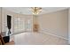 Bedroom with window, ceiling fan and hardwood floors at 3076 Hopkins Rd, Powder Springs, GA 30127