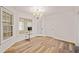 Bright dining area with hardwood floors and built-in shelving at 3076 Hopkins Rd, Powder Springs, GA 30127