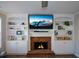 Brick fireplace with built-in shelving and mantle at 3820 Mast Nw Ct, Kennesaw, GA 30144