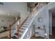 Elegant staircase with wood railing and neutral wall colors at 3820 Mast Nw Ct, Kennesaw, GA 30144