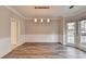 Spacious dining area with hardwood floors and wainscoting at 3930 Oak Park Dr, Suwanee, GA 30024