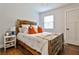 Cozy bedroom with rustic wood bed frame and ceiling fan at 2297 Carousel Ct, Marietta, GA 30066