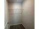 Walk-in closet with wire shelving and ample hanging space at 19 Loth Wages (Lot 19) Rd, Dacula, GA 30019