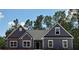 Two-story house with gray siding, stone accents, and a gray roof at 28 Loth Wages (Lot 28) Rd, Dacula, GA 30019