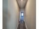 Hallway with vinyl plank flooring and access to bedrooms at 28 Loth Wages (Lot 28) Rd, Dacula, GA 30019