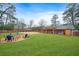 Expansive backyard featuring a fire pit and spacious patio at 3890 Kemp Ridge Rd, Acworth, GA 30101