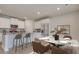 Modern kitchen with an island, stainless steel appliances, and an adjacent dining area at 416 Newland Way, Acworth, GA 30102