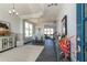 Bright entryway with hardwood floors, a view of the dining area, and a modern chandelier at 418 Newland Way, Acworth, GA 30102