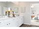 Double vanity bathroom with a large mirror and view into bedroom at 139 Kingsley Way, Acworth, GA 30102