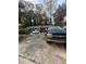 House with driveway, two cars, and people at 5623 Westhill Cir, Atlanta, GA 30349