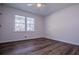 Bright bedroom with large windows and wood-look floors at 280 Hitchcock Rd, Dallas, GA 30157