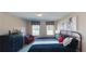 Spacious main bedroom with a metal bed frame and large windows at 3810 Reserve Overlook Lot14 Way, Cumming, GA 30041