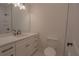 Clean bathroom with white cabinets and quartz countertop at 3007 Holly St., Canton, GA 30115