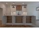 Open kitchen island with ample storage space, white cabinets, and wood accents at 3007 Holly St., Canton, GA 30115