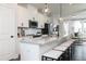 Modern kitchen with white cabinets, stainless steel appliances, and large island at 353 Skylar Se Way, Atlanta, GA 30315