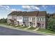 Row of modern townhouses with gray roofs and brick and white siding at 353 Skylar Se Way, Atlanta, GA 30315