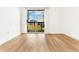 Bright bedroom with hardwood floors and balcony access at 1075 Peachtree Ne Walk # A517, Atlanta, GA 30309