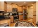 Modern kitchen with stainless steel appliances and granite countertops at 129 Owens Farm Ln # 15, Woodstock, GA 30188