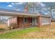 Brick home with ramp and screened porch at 3131 Front St, Ellenwood, GA 30294