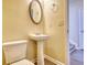 Small bathroom with pedestal sink and toilet at 8138 Brookbend Dr, Douglasville, GA 30134